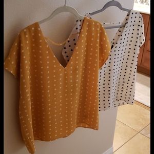 Two shirts, both size medium, one never worn